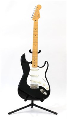 Lot 2069 - Fender Squier Stratocaster Guitar no.O030398 Made in Japan. black body with white scratchplate,...