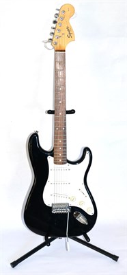 Lot 2075 - Fender Squier Strat (Made In China) no. CY02122560 with black body and white scratch plate and...