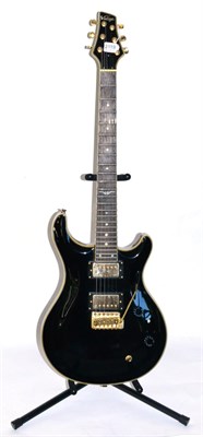 Lot 2119 - Vintage Double Cutaway Electric Guitar, with black finish, gold plated Wilkinson Humbucker Tuners