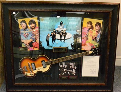 Lot 2174 - Beatles Display containing Bass Guitar (strung right handed) and images of the Beatles 54x45',...