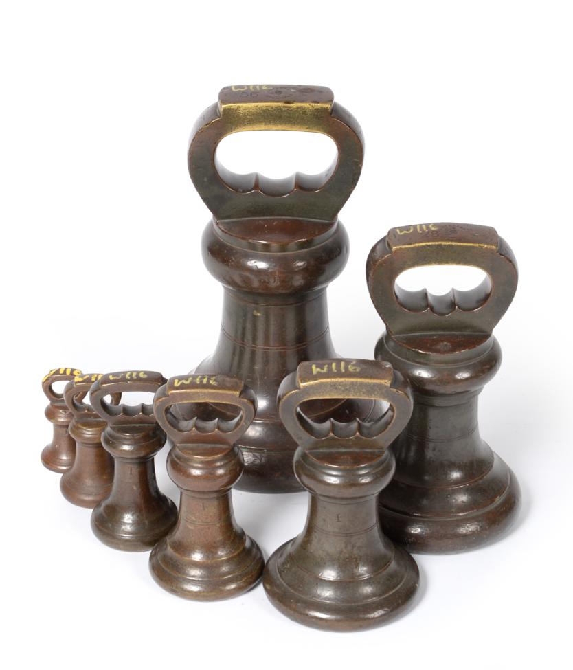 Lot 2236 - Bronze Bell Weights - A Set Of Eight 56lb, 28lb, 14lb, 7lb, 4lb, 2lb and 1lb, stamped 'Imperial...