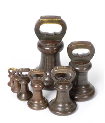 Lot 2236 - Bronze Bell Weights - A Set Of Eight 56lb, 28lb, 14lb, 7lb, 4lb, 2lb and 1lb, stamped 'Imperial...