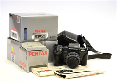 Lot 2336 - Pentax SFX Camera with SMC Pentax-F f3.5-4.5, 35-70mm lens, in leather case, with three...