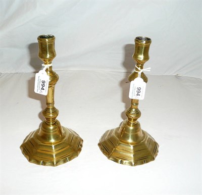 Lot 994 - A Pair of Late 18th Century Brass Candlesticks, of octagonal form, raised on stepped domed bases to