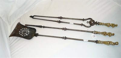 Lot 997 - A Set of Three George III Steel and Brass Mounted Fire Irons, the shovel with bell shape...