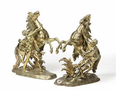 Lot 1000 - A Pair of Gilt Bronze Marly Horse Groups, after Guillame Coustou, French, 19th century, each as...