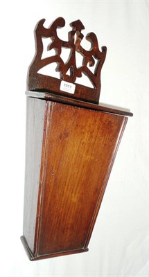 Lot 1011 - A Walnut Candle Box, with carved and pierced strapwork surmount to the lidded tapered box, 50cm...