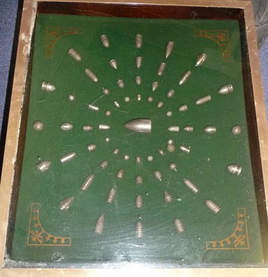 Lot 57 - A Display of Bullet Heads, and moulded lead bullets in a glazed top brass framed table on oak...