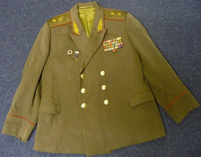 Lot 90 - A Post 1974 U.S.S.R.General Lieutenant's M69 Type Green Jacket, with red piping to the...