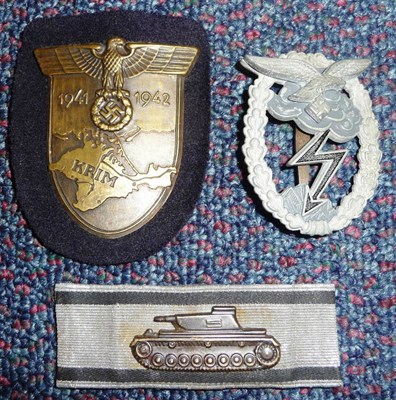 Lot 98 - A German Ground Combat Badge, the zinc body with grey enamelled cloud and black granular...