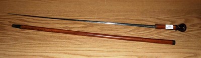 Lot 130 - A Georgian Malacca Sword Stick, the 79cm fullered triangular section tapered steel blade...