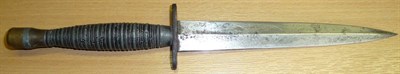 Lot 148 - A Commando Fighting Knife, the 17.5cm double edge machine made steel blade lightly engraved on...