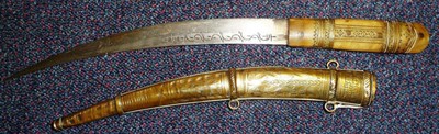 Lot 153 - A Late 19th Century Indian Dagger, the curved single edge steel blade incised with "S" scroll...