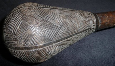 Lot 163 - A South Sea Islands Wood Throwing Club, the ovoid head with four incised panels of diapering,...