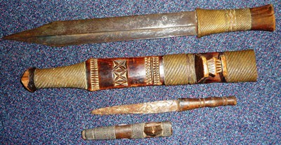 Lot 165 - A Shona Sword, the 35cm double edge with concave fuller to each opposing edge, brass wire bound...