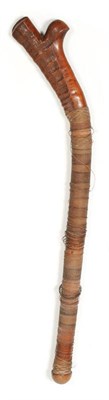 Lot 175 - A Fijian Gun Stock Club (Cali), of a hard dense golden brown wood, with naturally ribbed head,...