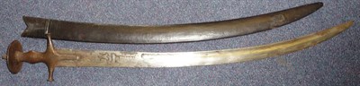 Lot 176 - A 19th Century Indian Talwar, the 74cm single edge curved fullered steel blade engraved with...