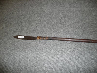 Lot 177 - A Bornean Sumpitan (Blowpipe), the tapering hardwood tube terminating  with a wicker bound...