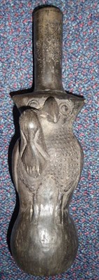 Lot 181 - A Chimu, pre-Inca Blackware Bottle, in the form of a magical  owl, 21.5cm high, circa 1200-1400AD