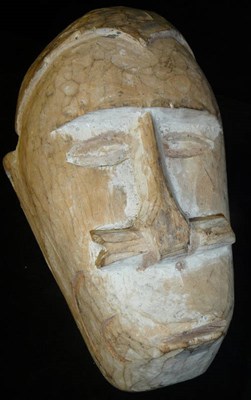 Lot 202 - An African Carved Wood Head, of a man with close cropped hair, deep set eyes, a bone piercing...