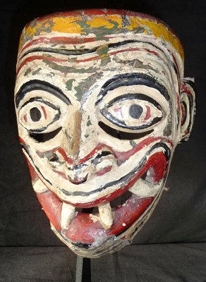 Lot 207 - A Polychrome Wood Tribal Mask, possibly Tlingit, North West Coast of America, with furrowed...