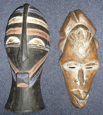 Lot 209 - A Basonge Ebonised Wood Mask, with medial ridge running down the forehead to the angular nose, with