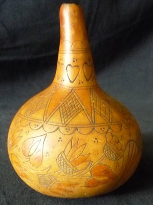 Lot 212 - A South African Gourd Flask, incised and stained with flowers and hearts, 12cm high