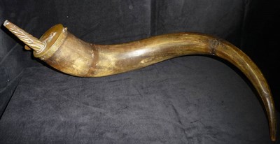 Lot 219 - An Early 19th Century German Powder Horn, the large recurving ox horn with brass mount,...