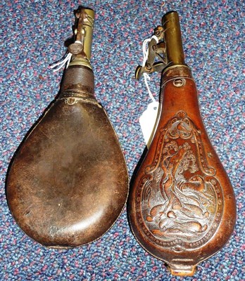 Lot 229 - A Leather Shot Flask, the pear shape body embossed with a cartouche of game and a gun dog with...