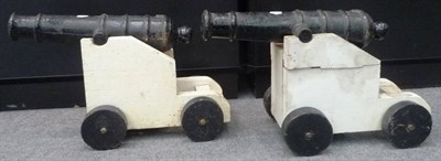 Lot 280 - A Pair of Victorian Black Cast Iron Signal Cannon, each with 53cm ringed barrel (including the...