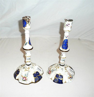 Lot 1044 - A Pair of Staffordshire Enamel Table Candlesticks, circa 1775, with cylindrical nozzles...