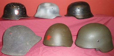 Lot 101 - A Swiss Model 1918/66 Steel Helmet, with granular painted surface and rolled edge, leather...