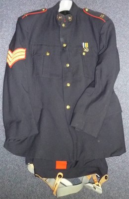 Lot 106 - A Royal Marines No.1 Blues Tunic and Trousers, to a sergeant, with brass buttons, shoulder...