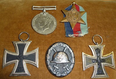 Lot 108 - A German Third Reich Iron Cross, second pattern, the suspender ring stamped 65; an Imperial...