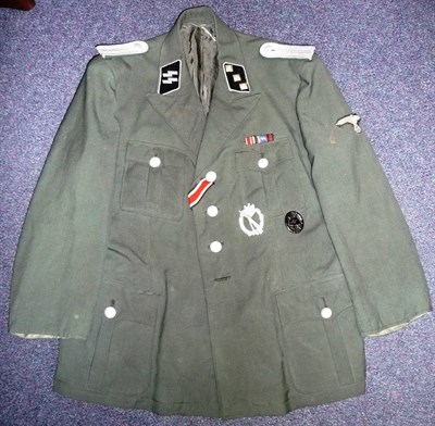 Lot 111 - A German Third Reich Green Tunic, with associated fittings including silver cord shoulder...