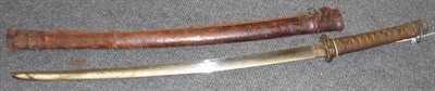 Lot 116 - A 19th Century Japanese Katana, the 67cm steel blade with one piece brass habaki, foliate cast...