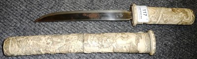 Lot 117 - A Japanese Aikuchi, with 19.5cm single edge steel blade, the bone hilt and double section...