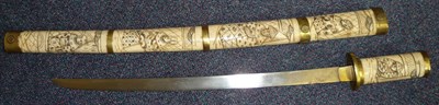 Lot 128 - A Japanese Wakizashi, with 40cm single edge steel blade, the brass mounted sectional bone hilt...