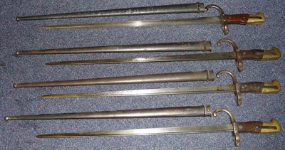 Lot 154 - Four French Model 1874 "Gras" Sword Bayonets, each with T section blade engraved with...