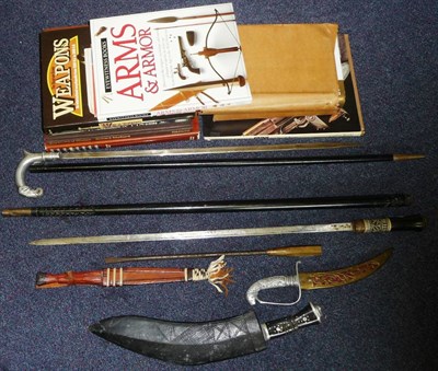 Lot 164 - An Indian Ebony Swordstick, with brass bayonet locking ferrule and bone inlaid grip; an Indian...