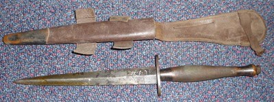 Lot 180 - A Second World War F.S.Fighting Knife, 2nd Pattern by Wilkinson Sword, London, the 17cm diamond...