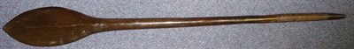 Lot 235 - A Solomon Islands Paddle Club, of dark brown colour, the leaf shaped head with raised medial...