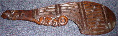 Lot 238 - A Maori Wood Wahaika (Hand Club), of rich brown colour, carved with bands of wave and notched...