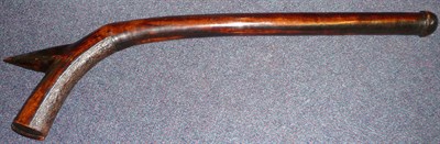 Lot 240 - A Fijian Gunstock Club, of dark brown colour, the spurred head with a panel of stone carved...