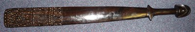 Lot 242 - A Solomon Islands Dark Wood Spatula Club, the flattened tapering oblong blade with pierced tip...