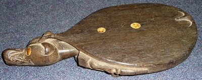 Lot 264 - A Dyak Head Hunter's Dark Hardwood Stool, carved in the form of a stylised fruit bat, the well...