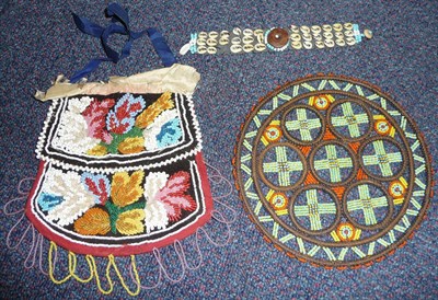 Lot 275 - A North American Indian Beadwork Purse, of brown velvet and red cloth, decorated with raised...