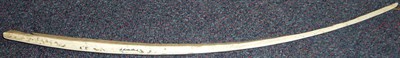 Lot 278 - An Inuit Walrus Ivory Bow Drill, of tapering square section, one side engraved and stained with...