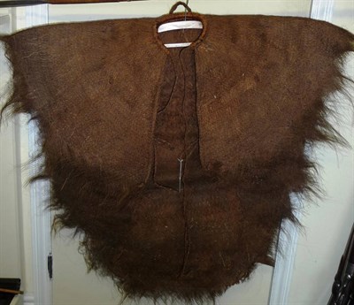 Lot 279 - A South Sea Islands Warriors Cape, of woven coir fibre, with wicker bound collar and twisted...