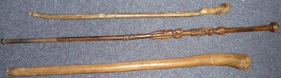 Lot 292 - A Zulu Chief's Wood Staff, with small globular pommel, the haft carved with the figure of a...